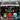 Mocsicka "It's About to Get Ugly" Ugly Christmas Sweater - Themed Backdrop