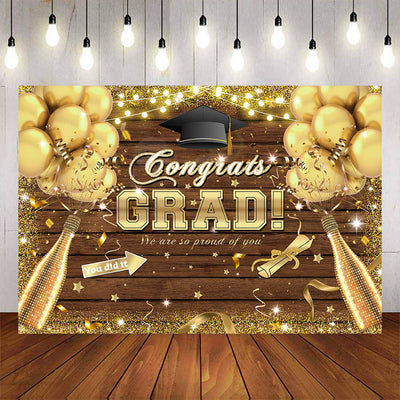 Mocsicka Congrats Grad Gold Balloons and Champagne Wooden Background-Mocsicka Party